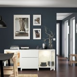 Modern dining with BESTÅ sideboard and decor.
