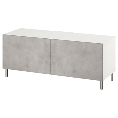 A modern white BESTÅ tv stand with grey textured doors and metallic legs.