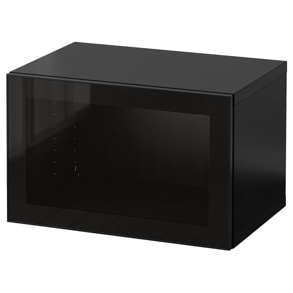 A black IKEA BESTÅ storage unit with a glass door.