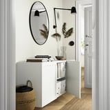 Modern entryway with BESTÅ storage. Includes adjustable shelves, wall-mounted with clean look.