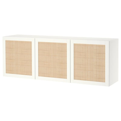 A white BESTÅ storage unit with three woven doors. It stands against a white background, featuring clean lines and an organised design.