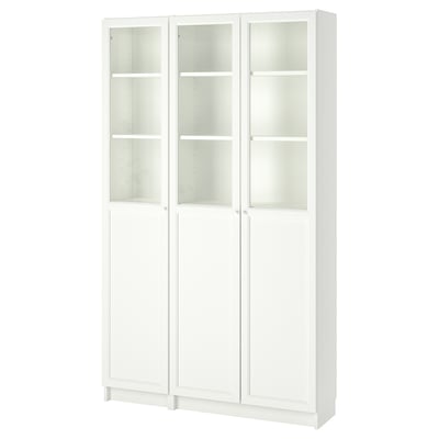 A white BILLY bookcase with glass doors, featuring multiple adjustable shelves.