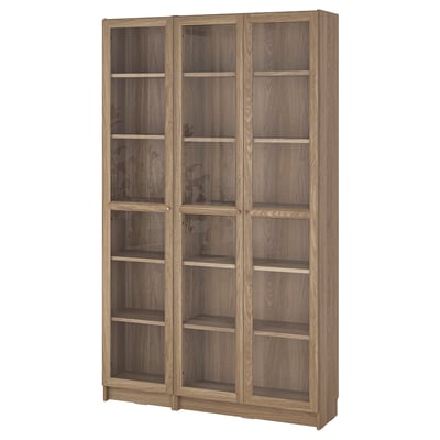 Wooden BILLY bookcase, light brown, rectangular, with glass doors.