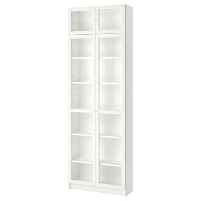 A white BILLY bookshelf with glass doors displaying multiple shelves.