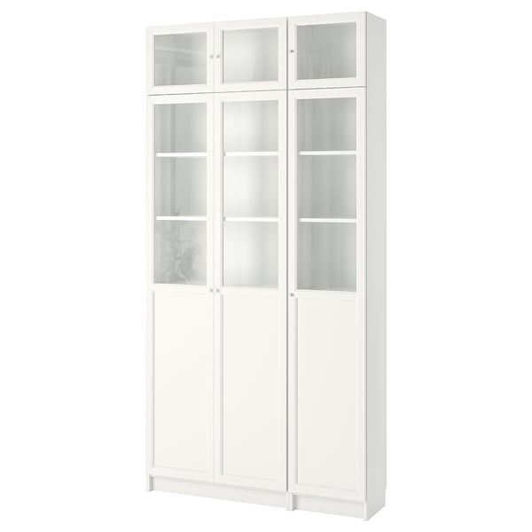 White BILLY bookshelf adjustable shelves, combination glass and panel doors, and a sleek, modern design.