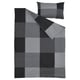 A grey BRUNKRISSLA duvet cover and pillowcase set, featuring a chequered design. Made of cotton and viscose.