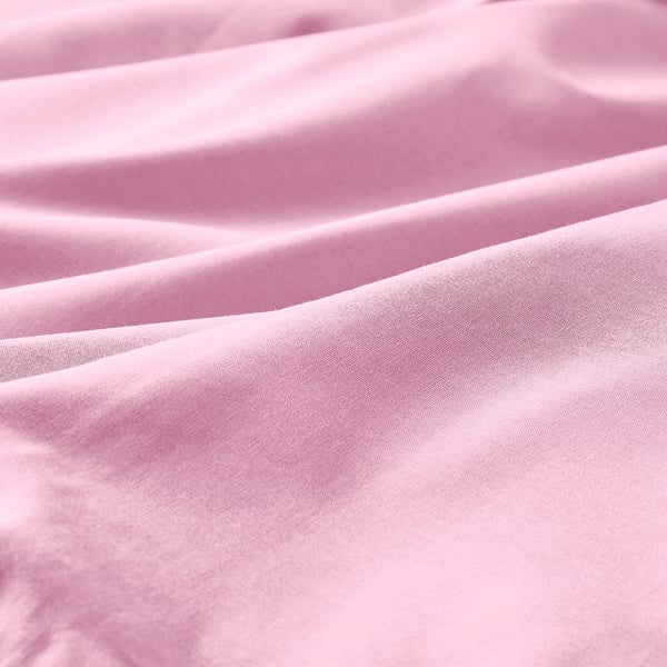 Close-up of soft, smooth pink fabric, showcasing its fine weave and gentle texture.
