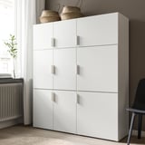 White FONNES cabinet with doors, offering unified storage and dust protection.