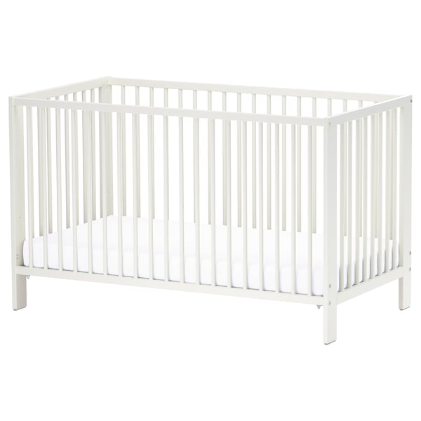 A white GULLIVER cot with adjustable base and removable side, designed for baby safety and comfort.