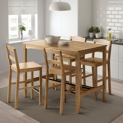 Brown wooden dining set with 4 ladder-back chairs, compact for small spaces.