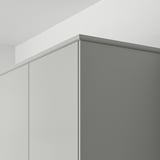 L-shaped light grey kitchen cabinet with hidden lighting.