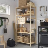 Wood IVAR shelf with storage items in room. Or, for fewer characters: wood IVAR shelf with storage.