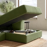 Green JÄTTEBO storage sofa, open storage box showing items inside. Modern design with ribbed upholstery.