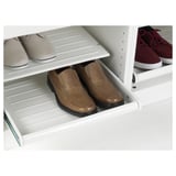 White, pull-out shoe shelf for pax wardrobe, holding 4 pairs evenly distributed.