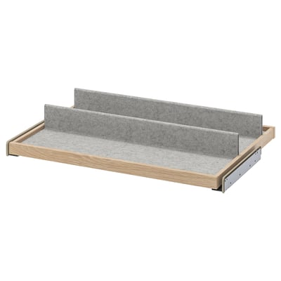 An IKEA KOMPLEMENT grey pull-out tray with a light wooden frame designed for organisers.