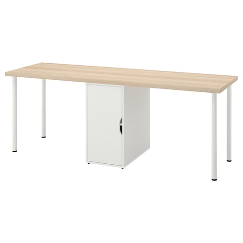 An ikea LAGKAPTEN desk, light brown top, white metal legs, with a white storage cabinet.