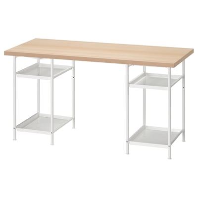 An ikea LAGKAPTEN desk. Light wood top, white metal legs. Two adjustable shelves, minimalist design.