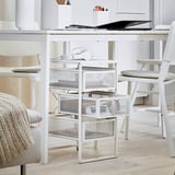 A white metal desk with drawers called LENNART. It has a slim design with wheels for easy movement.