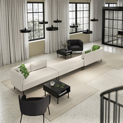 Modern living area with LILLEHEM white modular sofas, black coffee tables, black pendant lamps, and large windows with white curtains.