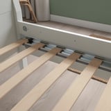 Close-up of wooden slatted bed base with metal rails, designed for air circulation and body-weight support.