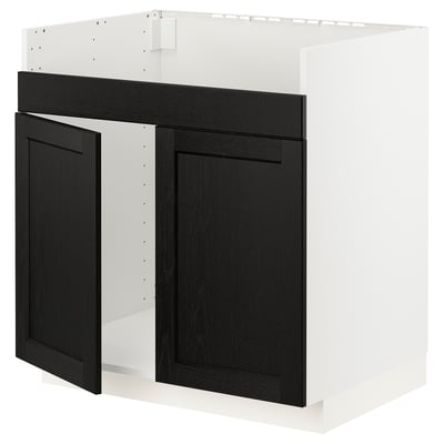 Modern black kitchen cabinet with white frame, bevelled edges, sturdy wood.