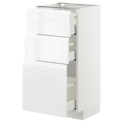 Modern white high gloss kitchen cabinet with multiple drawers.
