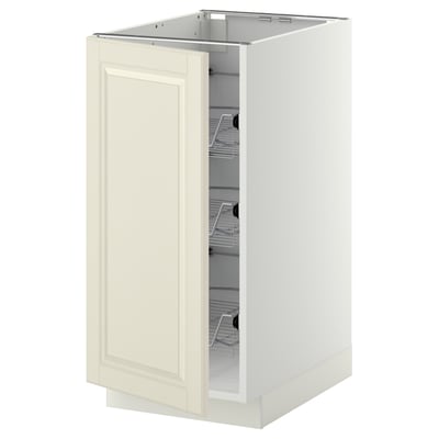 A white METOD kitchen cabinet with an off-white door and wire baskets.