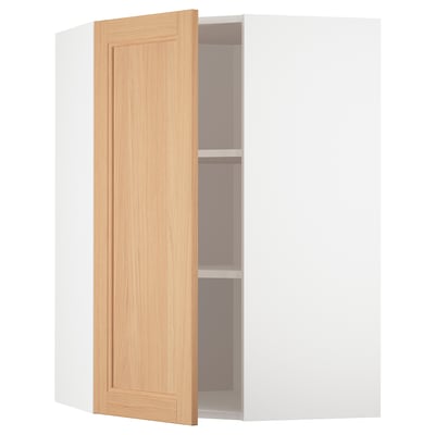 A white METOD kitchen cabinet with a light oak door open, revealing an adjustable shelf inside.