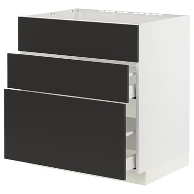 Modern kitchen unit, white with black drawers, metallic edges, sleek and minimalist.