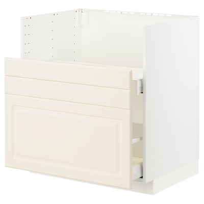 White kitchen cabinet with open drawer, bevelled edges, modern design.