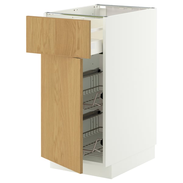 A white METOD kitchen cabinet with a light oak door and wire baskets.