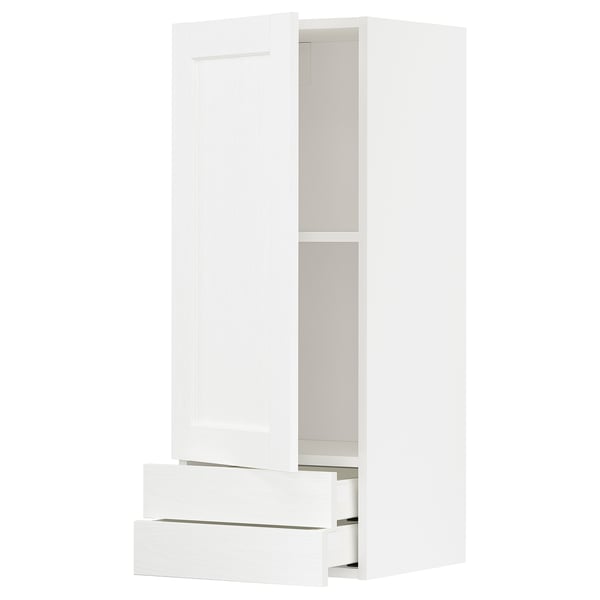 A white METOD kitchen cabinet with drawers. It a modern design with smooth drawers and a single shelf inside.