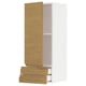 A white and light wood cabinet with open drawers and a door from the METOD kitchen system.