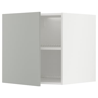 A light grey METOD kitchen cabinet with a single open door, revealing two shelves inside. The cabinet a modern, clean design with a smooth finish.