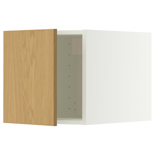 A METOD kitchen cabinet with a light oak door and a white frame. It snap-on hinges and a modern design with smooth surfaces.
