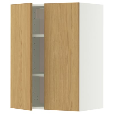 A METOD kitchen cabinet. Its wooden with a light oak finish. The cabinet has two doors and an adjustable shelf. The design is simple and modern.