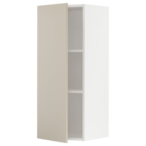 Beige METOD kitchen cabinet with two shelves, sleek and modern design.