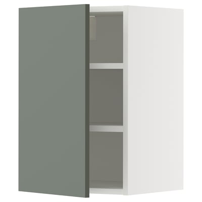 Modern METOD kitchen cabinet with grey-green door and adjustable shelves.