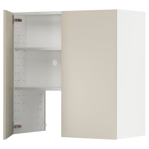 Beige METOD kitchen cabinet with one open door showing white shelves.