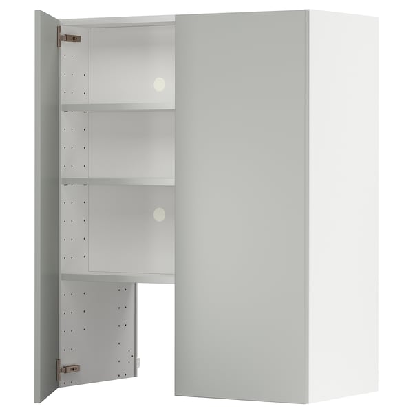 A white METOD kitchen cabinet with glass doors. It has a sleek, modern design with three shelves inside.