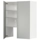 A white METOD kitchen cabinet with glass doors. It has a sleek, modern design with three shelves inside.