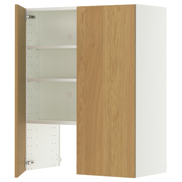 A light orange IKEA METOD kitchen cabinet with an open door revealing three shelves.