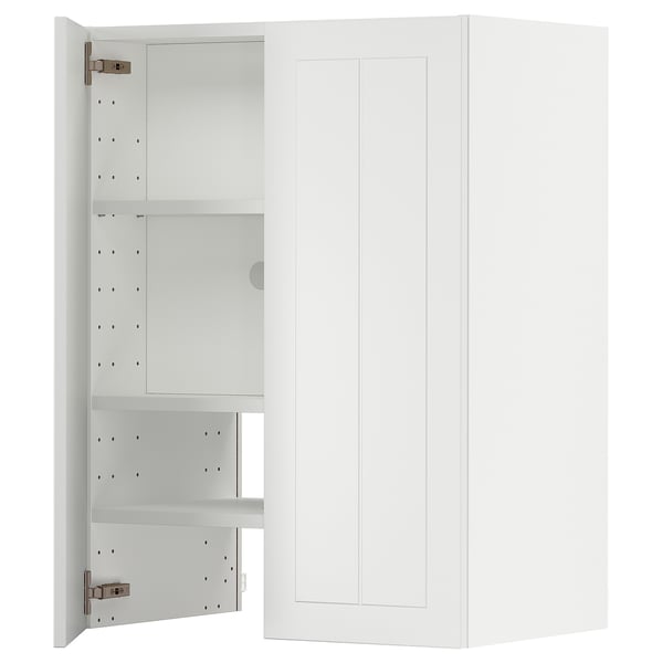 A white METOD kitchen cabinet with adjustable shelves and a door that can open from the left or right. It has a crafted look.