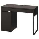 A black MICKE desk. Its rectangular with one drawer and a cabinet for storage. The design is modern and minimalist, perfect for small spaces.