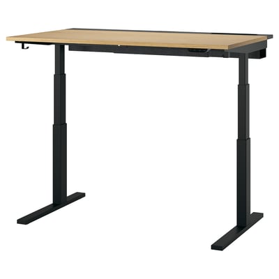 MITTZON adjustable desk. Black metal base, light wood top. Sit/stand functionality. Rectangular shape.