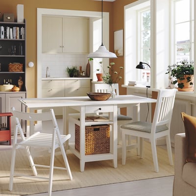 Modern dining set with storage in bright room.