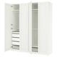 A white PAX wardrobe set with open doors, featuring shelves and drawers. Its made of particleboard and fiberboard, designed for efficient storage.