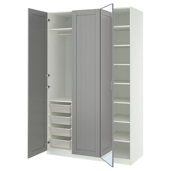 An open IKEA PAX wardrobe in white and grey with shelves and drawers.