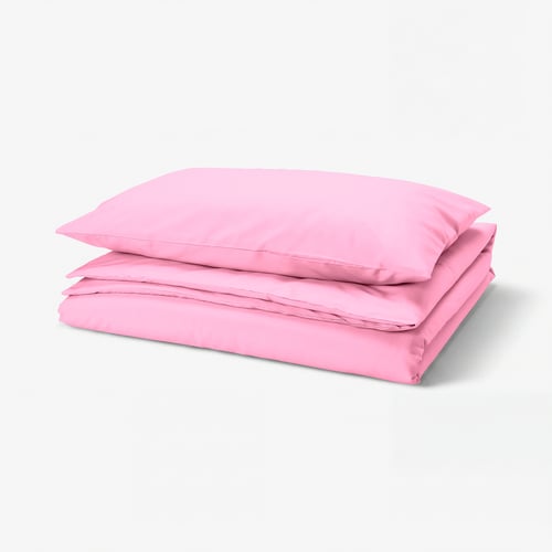 Bright pink folded bedding set with smooth, wrinkle-resistant fabric, featuring envelope pillowcases and plastic press-stud closure on duvet cover.