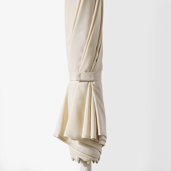 SAMSÖ adjustable parasol, folded, with secure loop strap for safe transport.